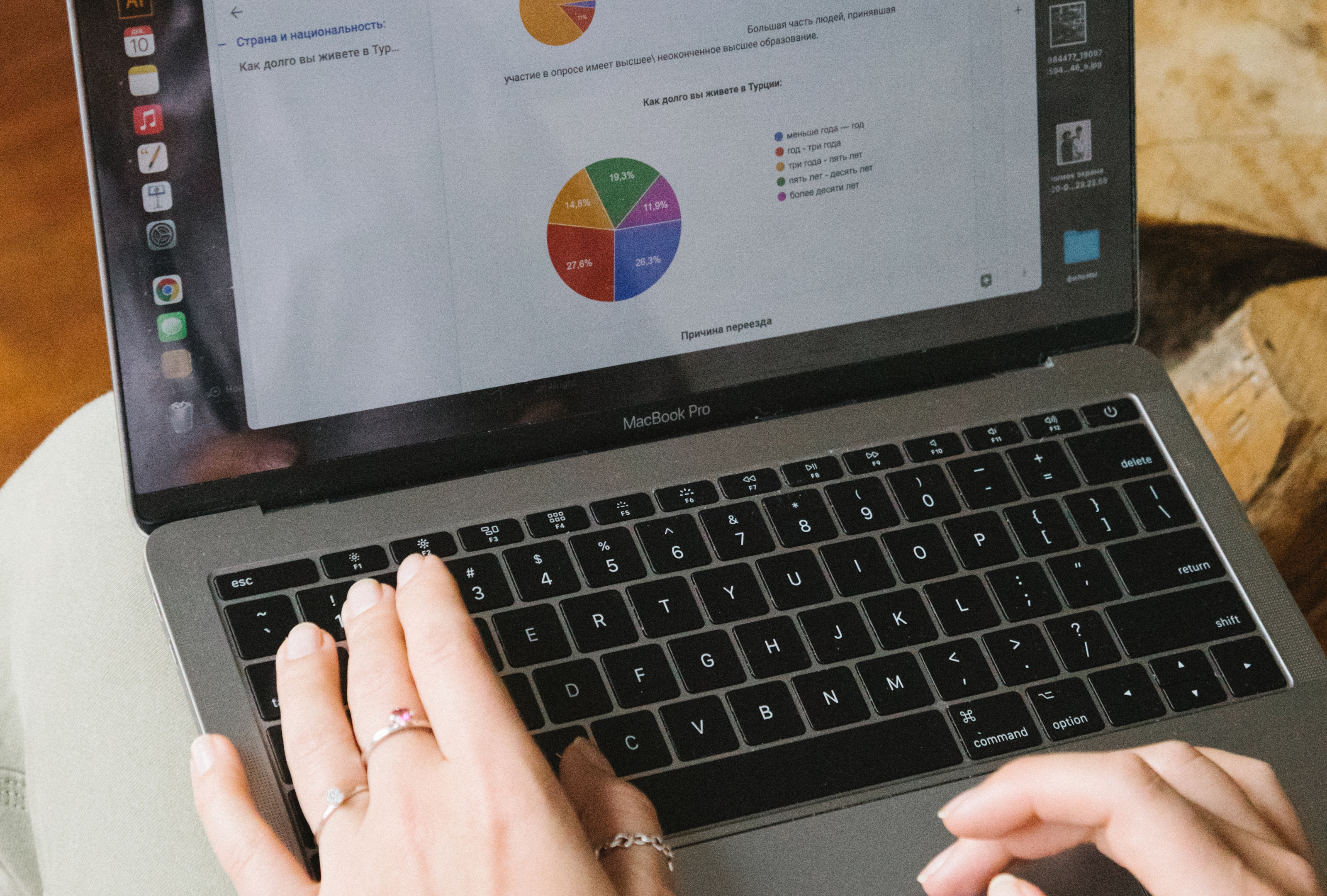 A person using a laptop to analyze competitor keywords for a PPC campaign