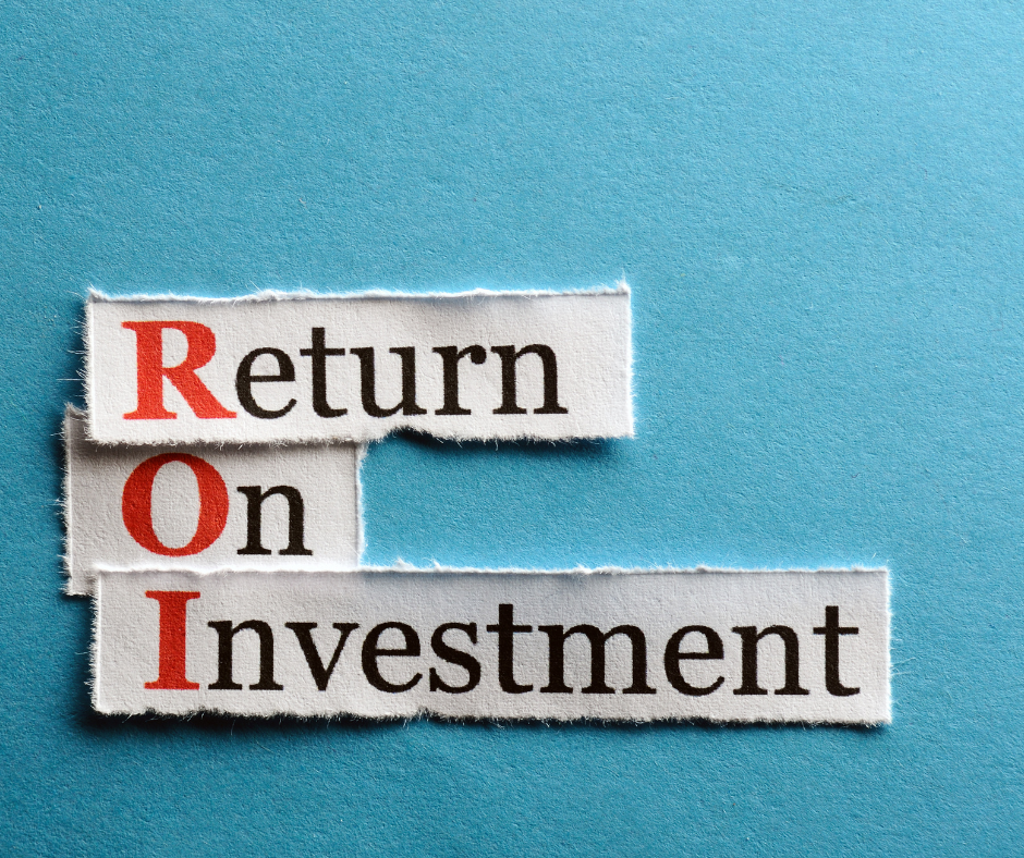 Two people discussing cost and ROI of Google Ads on laptop